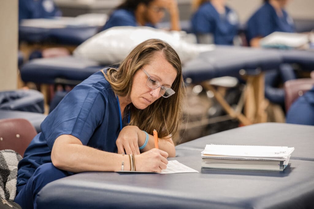 A massage therapy student studying for the MBLex exam